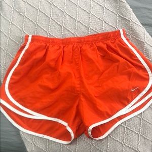 Bright orange Nike shorts